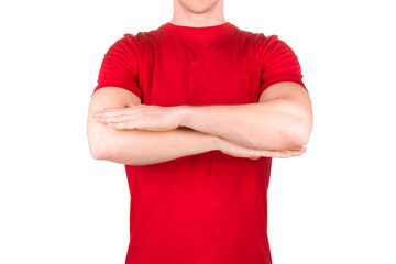 Front view of confident male in blank red t-shirt posing with crossed arms