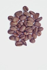 Close up of coffee bean in several composition with white background.