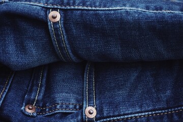 Naklejka premium Close up of jeans fabric in a jeans pant. Jeans fabric texture.