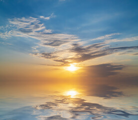 Naklejka na ściany i meble Sky background at sunset and sea water reflection.