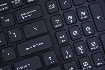 Close up of gaming laptop keyboard with futuristic font.