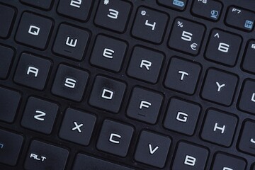 Close up of gaming laptop keyboard with futuristic font.