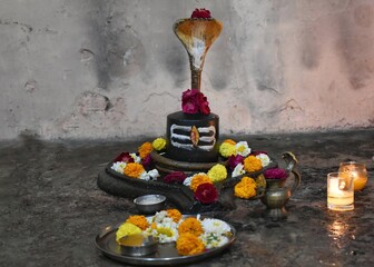 shiva shivling with flowers in a hindu temple