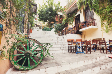 Charming greek street with cafes and restaurants, Plaka district, Athens, Greece. Travel, tourist destination, vacations concept	 - obrazy, fototapety, plakaty