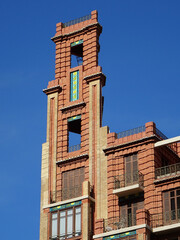 Fototapeta na wymiar Art Deco building with tower in the corner. City center of Valencia. Spain. 