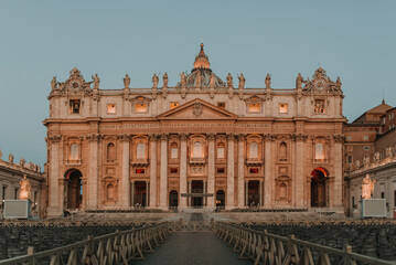 Historic facade of the basilica of St. Peter in Rome, Italy with Vatican city. Famous Saint Peter's Square in Vatican, made in 1506.