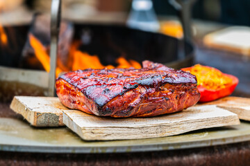 Fresh, delicious grilled meat. Grilling steak on BBQ. Close up view of grilling steak.