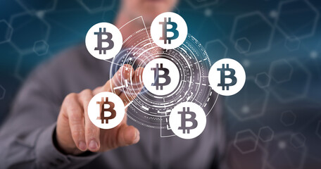 Man touching a bitcoin concept