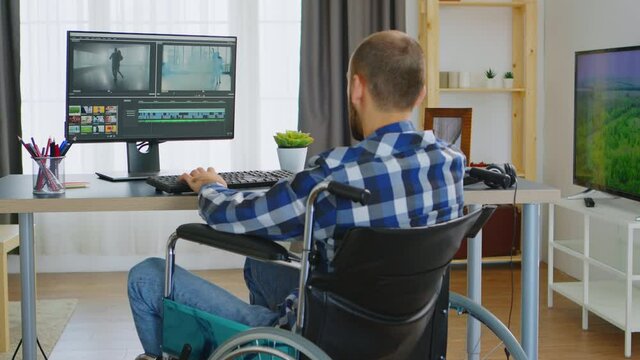 Professional video editor in wheelchair because of walking disability. Handicapped invalid paralysed freelancer, immobilized entrepreneur working from home, ilness and disability