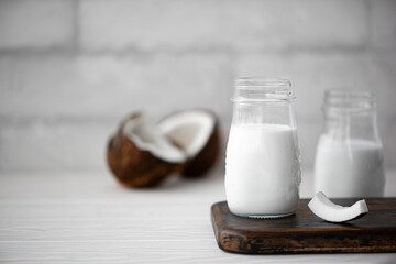 coconut milk in a glass bowl with chopped coconut
