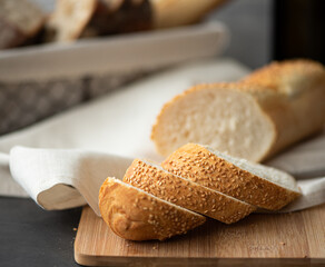 french baguette with sesame seeds chopped into pieces