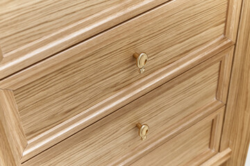 Wooden drawers of wardrobe close-up. Wooden wardrobe with wooden drawers and shelves. Wooden filling of wardrobe