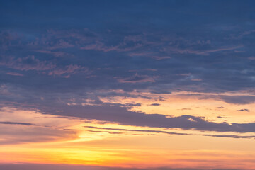 Fototapeta premium A red sunset. Dramatic evening sky with gloomy clouds.