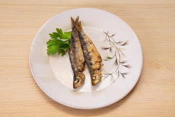grilled fish, sardines or anchovies with parsley
