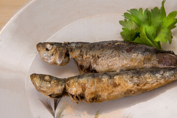grilled fish, sardines or anchovies with parsley