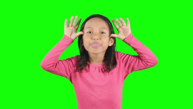 Little girl mocking somebody in the studio