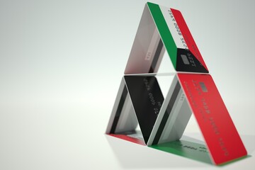 Flag of Kuwait on bank card house, fictional data. Financial instability related 3D rendering