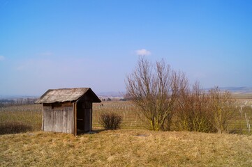 Wooden hut in autumn landscape
