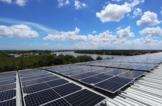 Solar PV Rooftop on Curve Roof under Construction Beautiful Sky and River Background