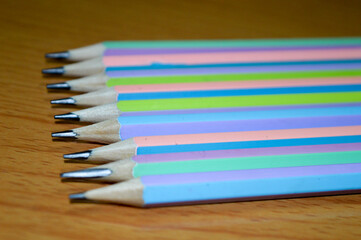 Fototapeta premium colored pencils on a wooden table
