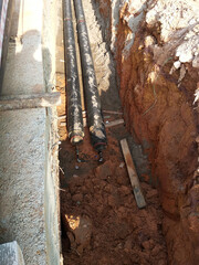 SEREMBAN, MALAYSIA -AUGUST 01, 2019: Underground utility and services pipe laid by workers in the trenches at the construction site. Installation of pipes still ongoing.   