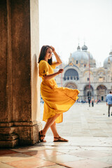 woman in yellow sundress at saint marco piazza