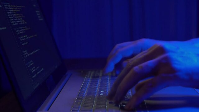A Criminal Hacker Breaks Into A Secure Computer System. The Process of a Hacker Attack, a Close-up.
