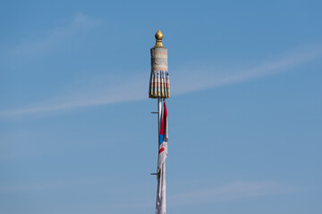 Obraz premium Buddhist prayer tower in a blue sky