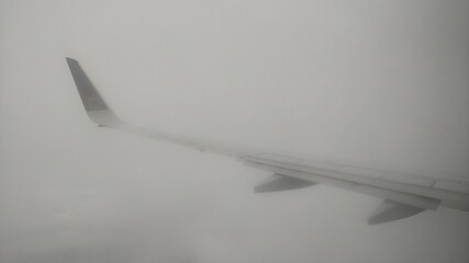 airplane flying over the clouds