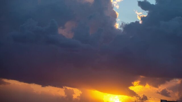 Loopable video of clouds moving in sky at sunset over Mediterranean sea