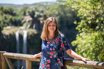 Woman on the background of the waterfall of Chamarel Mauritius