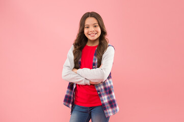 Beauty is whatever gives joy. Little beauty smile pink background. Beauty look of adorable kid. Small girl keep arms crossed in casual style. Beauty and fashion. Because your worth it