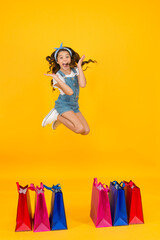 Happy child with bags. Small child in summer style. Seasonal sales. Happiness of purchase. Shopping day. Fashion boutique. Cheerful girl shopping. Cosmetics shop. Little girl with shopping packages