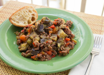 dish of vegetable stew. stewed eggplant, minced meat, carrots, peppers, onion squid
