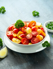 Healthy Tomato cherry salad in white bowl