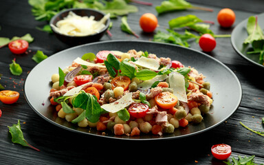 Mini potato gnocchi tricolour with tomato, spinach, Seasonal salad leaves and parmesan cheese
