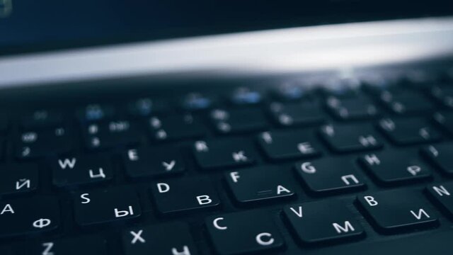 Close-up keyboard with Russian and English layout.