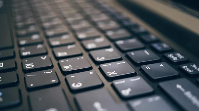Close-up keyboard with Russian and English layout.