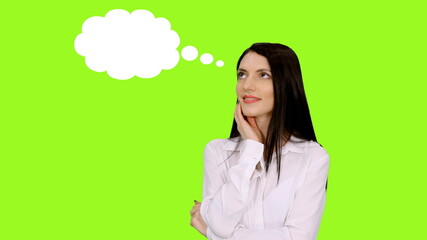 Close-up of charming woman in white blouse dreaming of something with beautiful smiling, thought bubble of clouds on green screen background, Chroma key