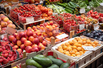  Fresh fruits and vegetables on market stall. Traditional food market in the center of Bologna, Italy. Selective focus.
