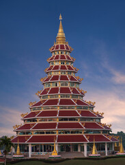 Buddhist Chedi (pagoda) in Chinese style at Wat Huay Pla Kang, known as Big Buddha temple on sunset in Chiang Rai, North Thailand