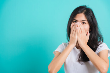 Portrait Asian beautiful happy young woman wear t-shirt happy excited laughs covering mouth with...