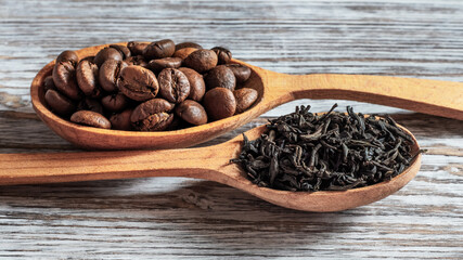 Tea and coffee in wooden spoons. Choice between tea and coffee