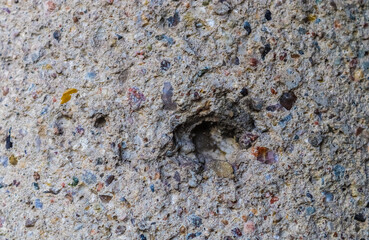 Detailed view on aged concrete walls with cracks and a lot of structure in high resolution