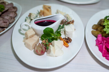 Slicing different varieties of cheese