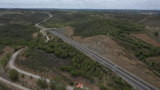 Aerial drone view of Highway road in Odeleite Dam reservoir - Algarve, Portugal