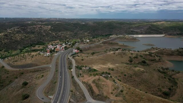 Aerial drone view of Highway road in Odeleite Dam reservoir - Algarve, Portugal