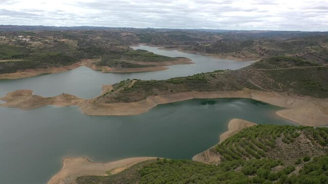 Aerial drone view of Odeleite Dam reservoir in Algarve, Portugal