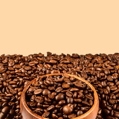 Close-up coffee beans in the wooden bowl with empty copy space