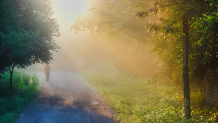 Fototapeta na wymiar A man walk on a mist foggy Morning